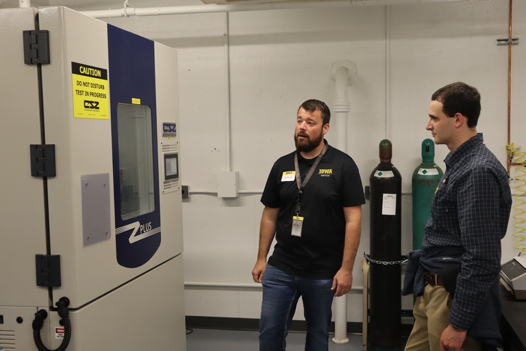 Rich Dvorsky shows Sanny Omar the thermal testing unit