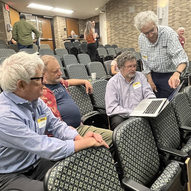 Kletzing's colleagues discuss a research project