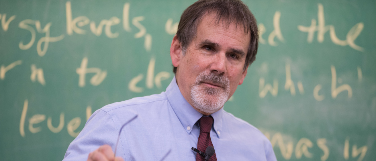 Prof. Craig Kletzing in front of a blackboard