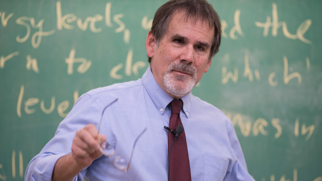 Prof. Craig Kletzing in front of a blackboard